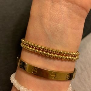 2 Gold beaded bracelets